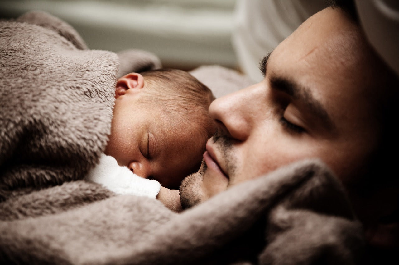 father asleep with a child 