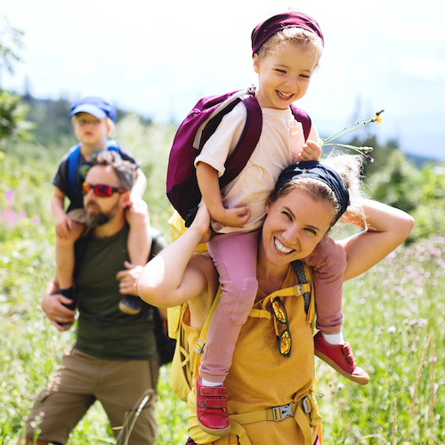 young girl on mothers shoulders