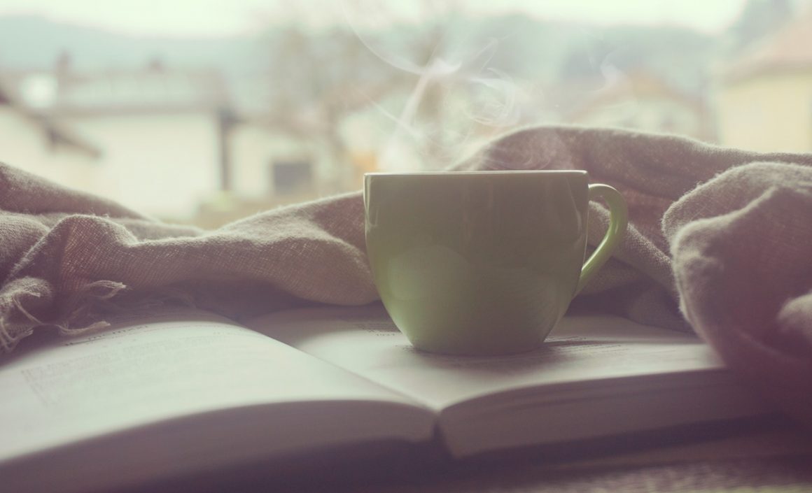 Parenting book with cup of tea